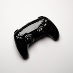 black ps5 controller in ceramic