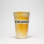 yellow cup in ceramic